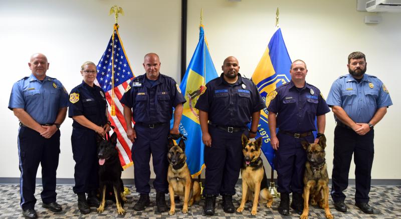 Delaware Department of Correction canine unit graduation attendees shown are (l-r) K9 Trainer Educator III Mark Bower; Sgt. Nicole Sroka and K9 Drago, James T. Vaughn Correctional Center; Officer Aaron Lankford and K9 Knox, Howard R. Young Correctional Institution; Officer Garrett Taylor and K9 Sirius, Sussex Correctional Institution; Officer Scott Bollinger and K9 Prince, Sussex Correctional Institution; and K9 Trainer Educator I Ryan Walker. SUBMITTED PHOTO